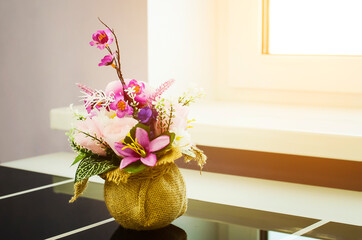 flower arrangement in vase on table decorated.