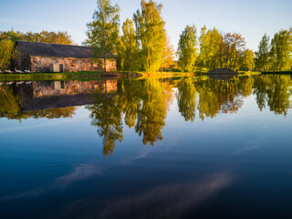 Fototapeta na wymiar Beautiful Tree Reflection in Lake on Sunny Day - Autumn Colors