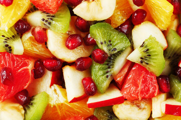 Fruit salad close-up in full screen, as a background.