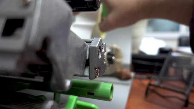 Working with a bar code printer. Direct thermal and thermal transfer label printmaking technique. Manufacturing label printing device.