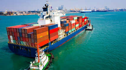container ship sailing in green sea and  tugboat drag  shipping to seaport