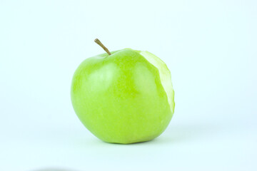 Green Apple with a white background with bite missing