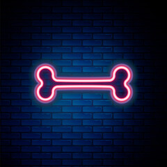 Glowing neon line Dog bone icon isolated on brick wall background. Pets food symbol. Colorful outline concept. Vector.