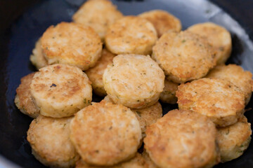 Piles of hash brown in the black plate.