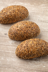 detail of several loaves with seeds on top, studio