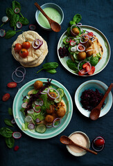 Home made vegan falafel  served with various mezze and pita bread