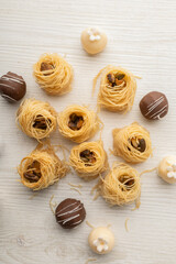 arabic desserts, there are nest with nuts, black and white chocolate balls, study delicious food