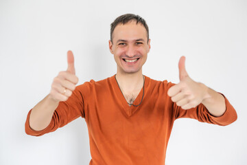 Closeup portrait of happy businessman shows thumbs up isolated on white background