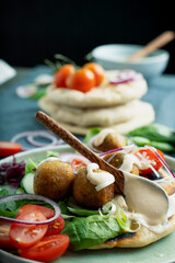Home made vegan falafel  served with various mezze and pita bread