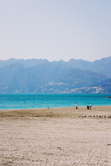 Fototapeta na wymiar new Salerno beach with people and city on the bottom