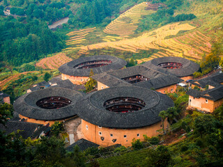 Panorama aerial landscape view of Tianluokeng Tulou cluster with mist,located in Fujian,China
