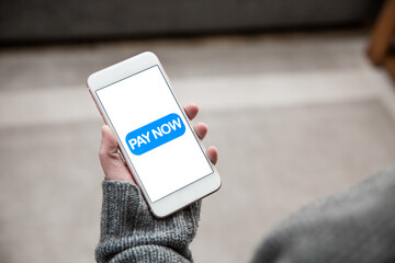Girl paying for online shopping on her mobile phone