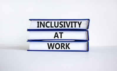 Inclusivity at work symbol. Books with words 'Inclusivity at work' on beautiful white background. Business, inclusivity at work concept. Copy space.