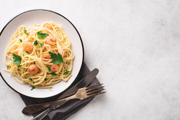 Spaghetti shrimp scampi in a plate with free space for text