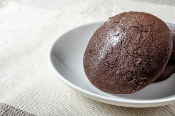 Chocolate biscuits with powdered sugar. High quality photo