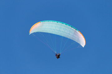 Twin paraglider. Paragliding against the blue sky.