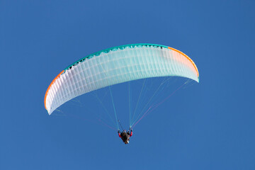 Twin paraglider. Paragliding against the blue sky.