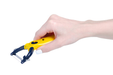 Vegetable peeler tool in hand on white background isolation