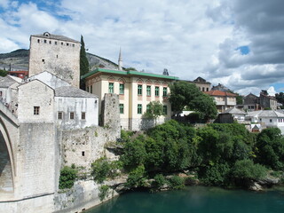 Fototapeta na wymiar Houses on the banks of the Neretva river, Bosnia Herzegowina