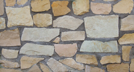 Asymmetric stone surface texture with ridges.
