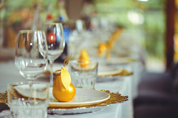 restaurant table setout with white plates and silverware