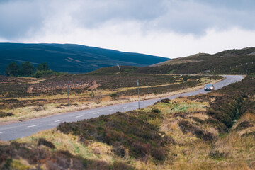 Fototapeta na wymiar Landscape with winding country roads in Scotland