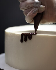decoration white cake with drops of chocolate
