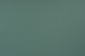 Green paper background. Pine green colour paper texture.