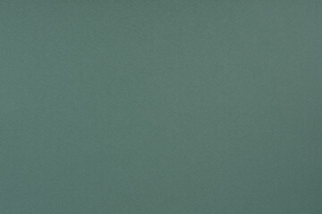 Fototapeta premium Green paper background. Pine green colour paper texture.