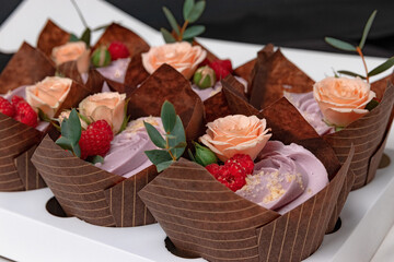 cupcake with berries and rose flowers