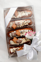 eclairs with chocolate cream and sprinkles