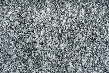 The surface texture of gray polished granite