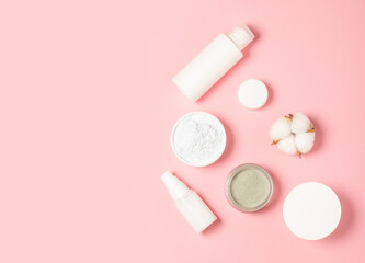 Alginate and clay face masks. Cosmetic products, masks and creams in jars. Top view, flat lay