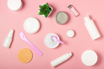 Alginate and clay face masks. Cosmetic products, masks and creams in jars. Top view, flat lay