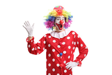 Funny cheerful clown waving