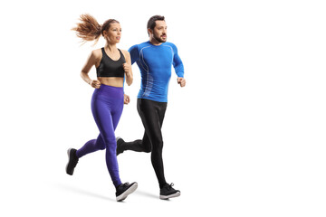 Full length shot of a young man and woman in sportswear running together