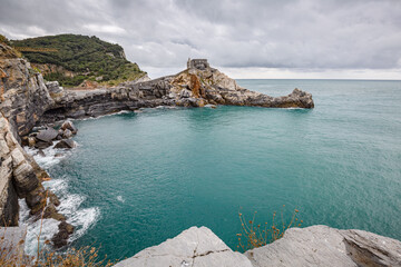 Portovenere (Porto Venere) in Liguria, Italy: beautiful aerial scenic view of the Church of St....