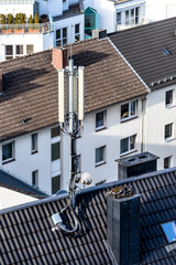 Fototapeta na wymiar Antennas and transmitters on roof. Technology on the top of a building (5G, 4G) .Mobile phone antennas on a roof.Telecommunication TV antennas.Communication system.