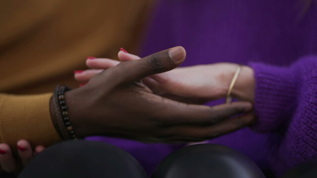 Diverse Interracial Young Couple Joining Hands Outside. Diversity Concept Union