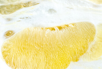 Grapefruit texture inside on the white background. Citrus close up photo. Healthy lifestyle photo. Beautiful wallpaper. Vegetarian and vegan concept. Vitamins from nature.