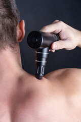 muscle massager fitness athlete gun self massage. High quality photo