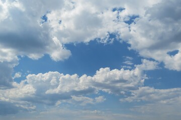 Fototapeta na wymiar Fluffy clouds in the blue sky
