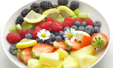 delicious fruit salad with fresh strawberry,kiwi,blackberry,pineapple and raspberry