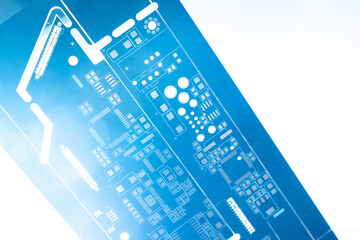 White and blue PCB background. Radio-electronic components. Production of printed circuit boards. Place for text.