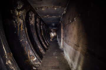 Fototapeta na wymiar Dark burnt abandoned Soviet bunker after fire