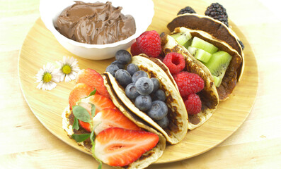 Classic American pancakes with fresh fruits. Summer homemade breakfast.