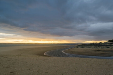 Fototapeta na wymiar Gloomy clouds, sunset over the sea, storm, Huelva