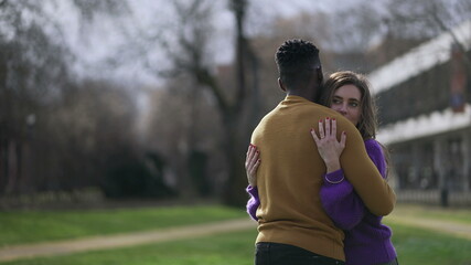 Obraz premium Interracial hug. Black man with while girlfriend embrace. love and affection