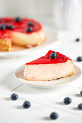 Classic New York cheesecake on white background, Greek mood
