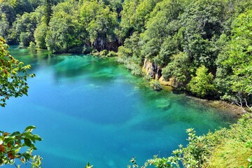 Fototapeta na wymiar Breathtaking view in the Plitvice Lakes National Park. Turquoise transparent water in karst cascading lakes